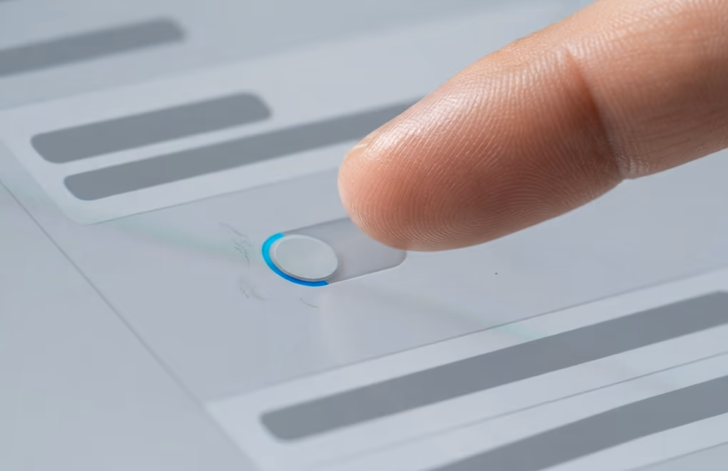 A hand switching off a share toggle before saving a profile edit