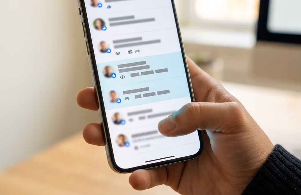 A notifications panel showing post reactions, profile views, and job changes flagged as warm leads