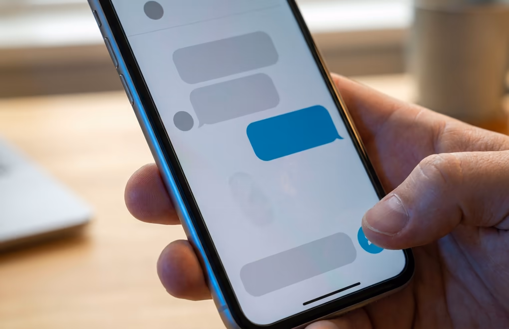 A short personalized LinkedIn message drafted to a prospect on a phone
