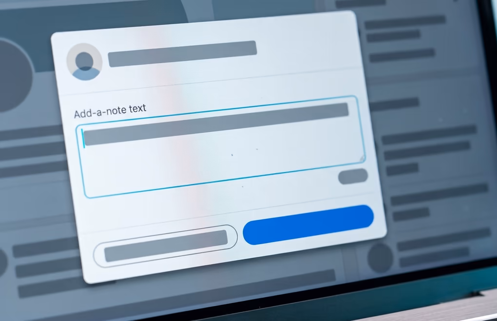 A LinkedIn connection request note being typed in the add-a-note box on a phone