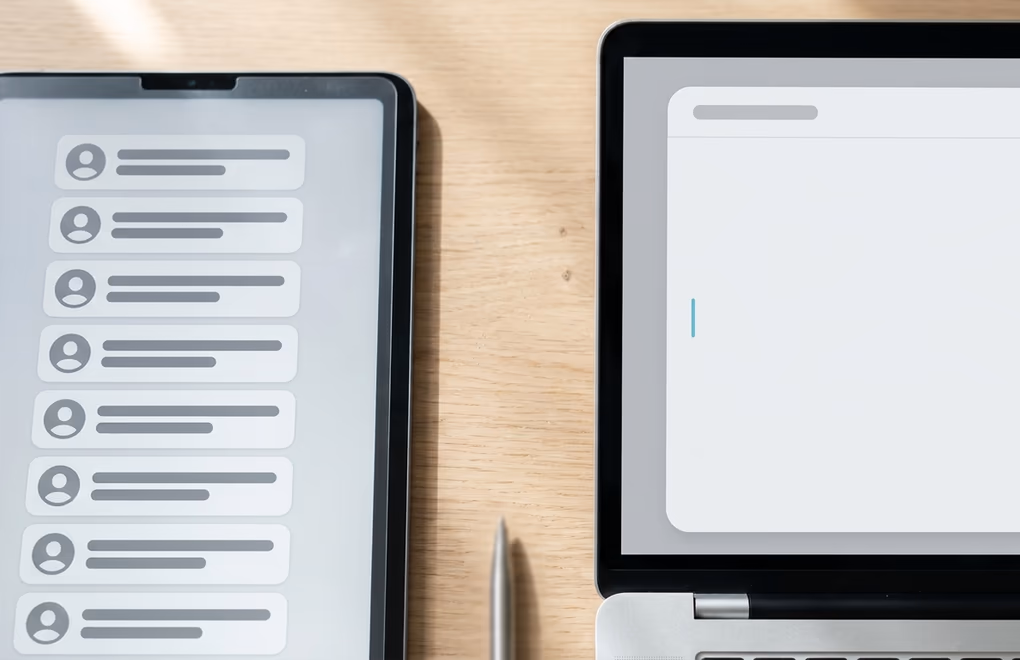 A tidy lead list on one screen and an empty message box waiting on the other
