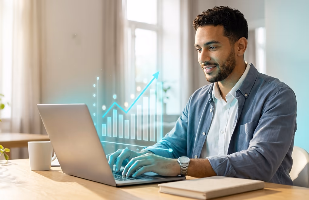 A professional drafting a post on a laptop beside a rising bar chart of climbing weekly views
