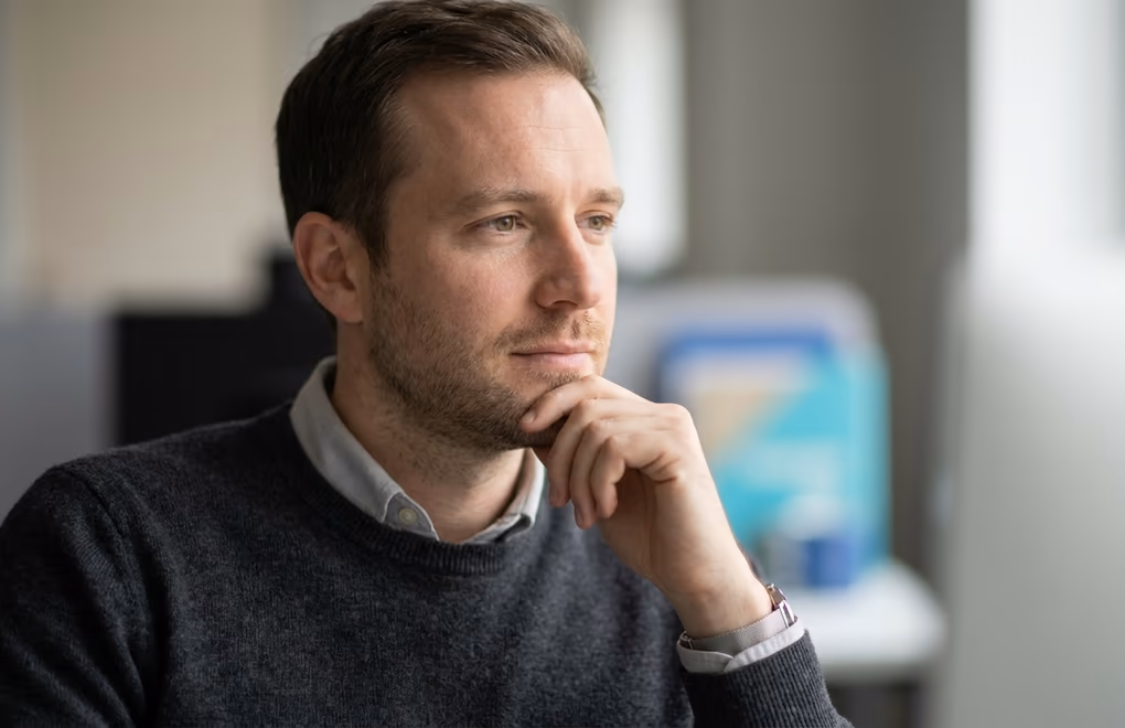 A seller listening closely to a buyer's concern during a calm sales conversation